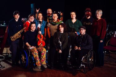 Harry Basset and others pose for a group photo while taking part in the Trailblazers Residency with Diverse City.