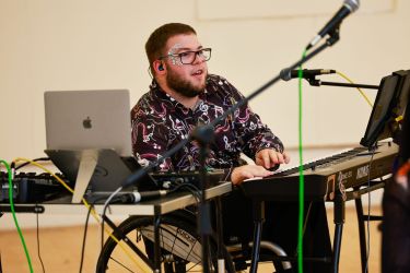 Harry Bassett at a keyboard during an R&D.